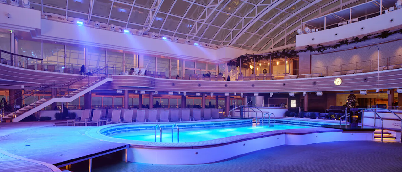 The 970m² retractable SkyDome glass roof is the special entertainment feature of the ship