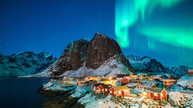 The Northern Lights over a town in the Norwegian Fjords