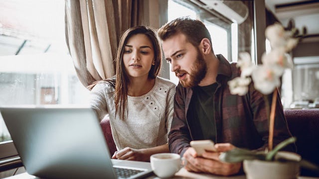 Couple booking a Norwegian Fjords Cruise online