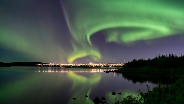 Northern Lights over Reykjavik city