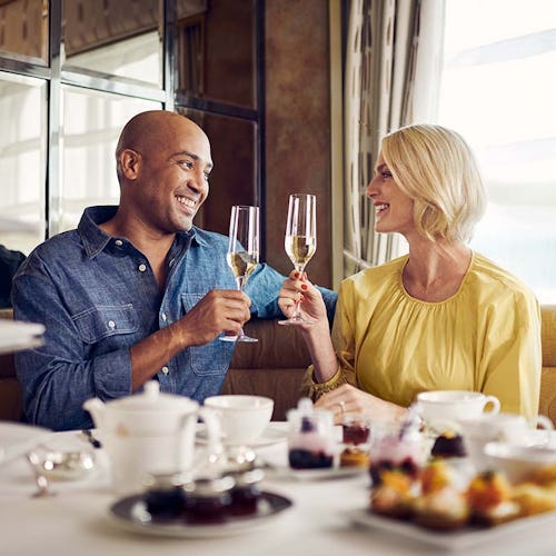 Guests enjoying afternoon tea on board Cunard