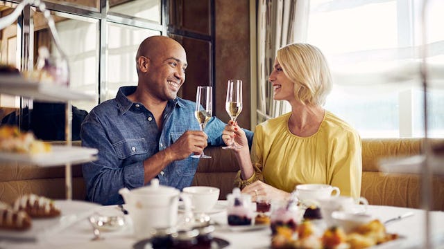 Guests enjoying afternoon tea on board Cunard