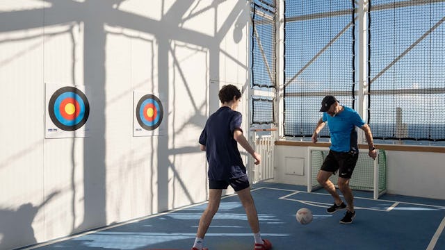 People playing in the sports arena on board Arvia