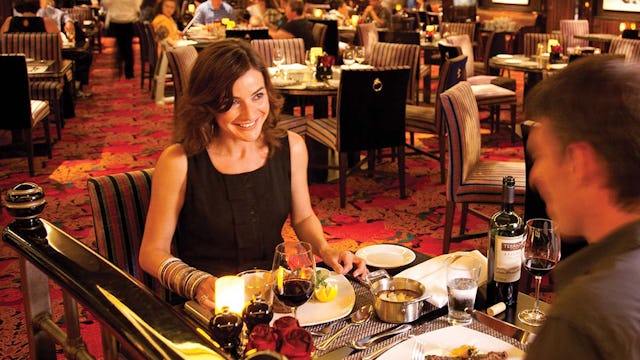 Couple dining in Cagney's Steakhouse, Norwegian Cruise Line