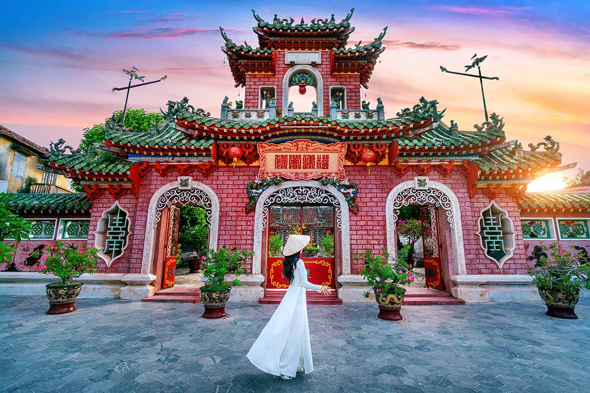 Tourist walking at Fukian Assembly Hall in the Hoi An ancient town, Vietnam.