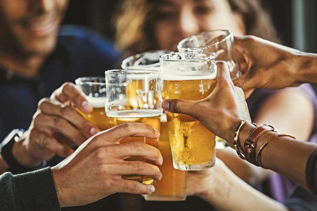 People enjoying a pint on board