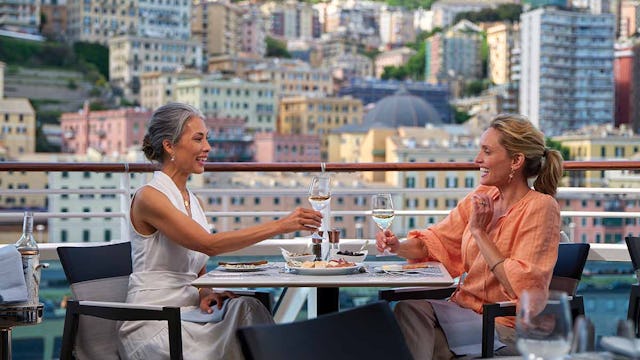 Women enjoying a meal al fresco on the Oceania Terrace Cafe