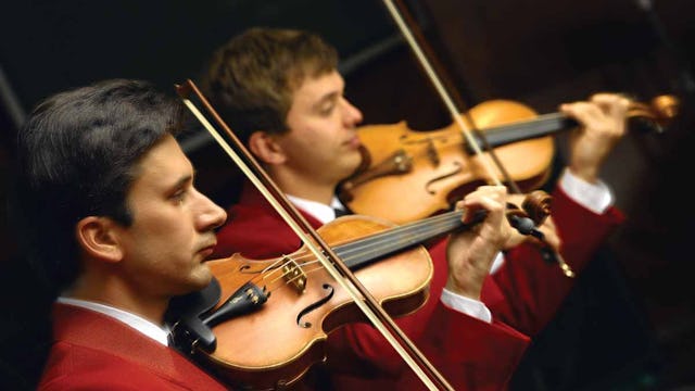 Violinists performing on Oceania