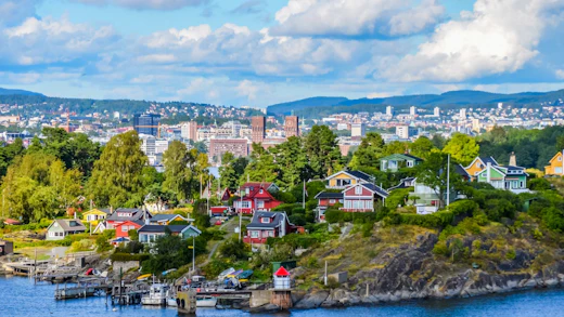 View of Oslo between city and typical nordic cottages