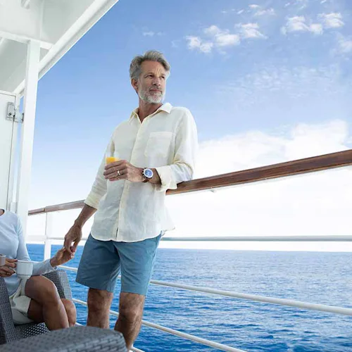 Couple on a balcony of Seven Seas Voyager