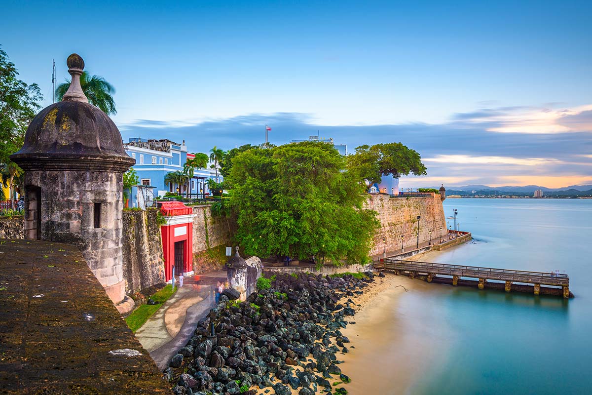 San Juan, Puerto Rico Caribbean coast along Paseo de la Princesa at dusk.