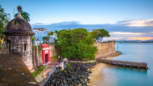 San Juan, Puerto Rico Caribbean coast along Paseo de la Princesa at dusk.