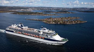 Celebrity Constellation Cruise Ship sailing past an island