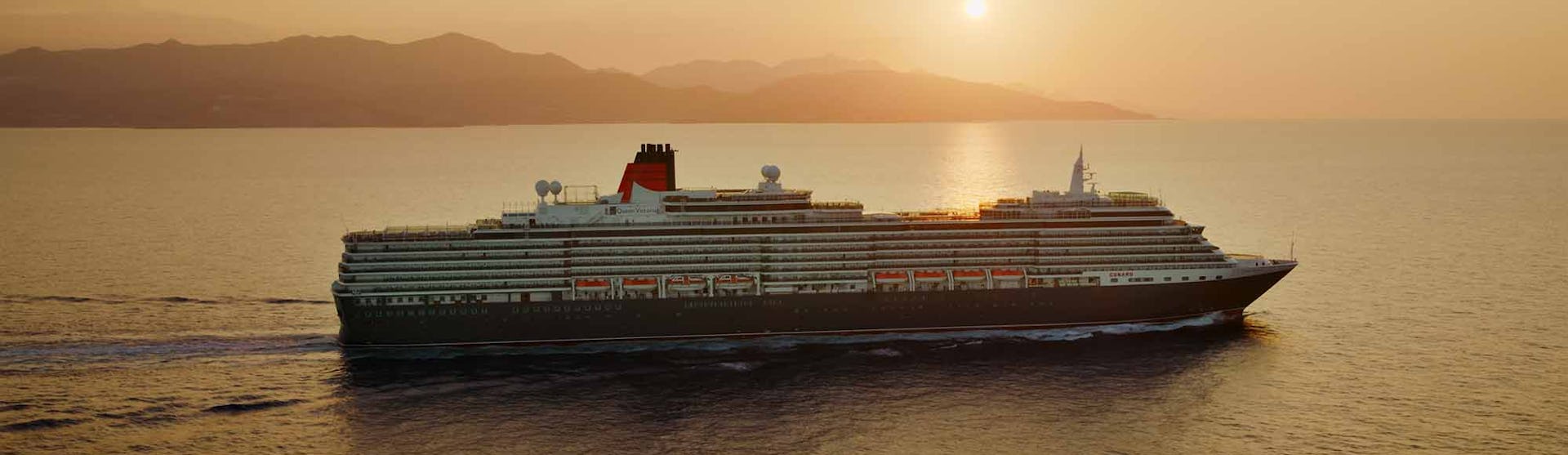 Cunard Queen Victoria sailing at sunset