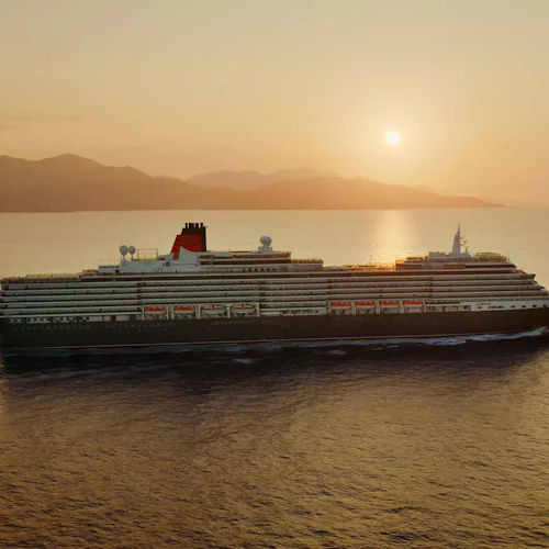 Cunard Queen Victoria sailing at sunset