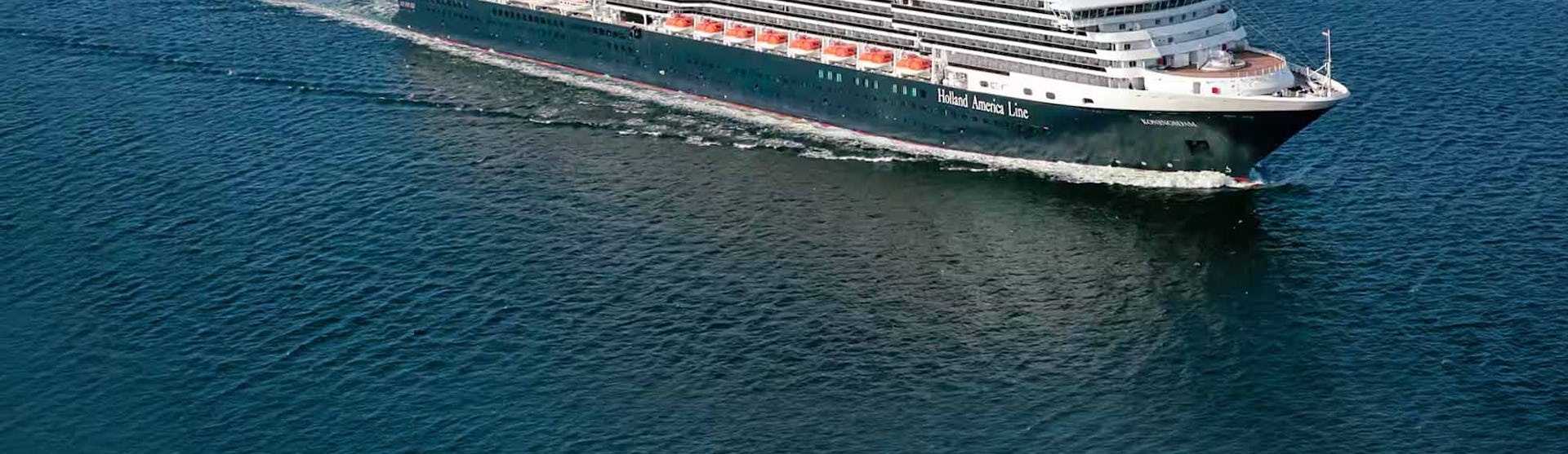Holland America Koningsdam sailing into view