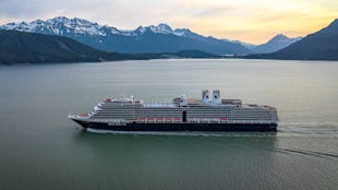 Holland America Nieuw Amsterdam sailing through mountains