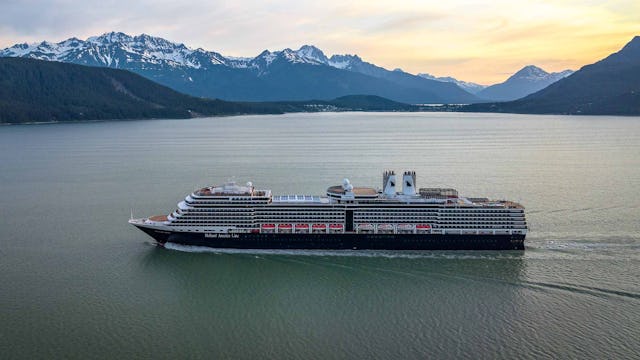 Holland America Nieuw Amsterdam sailing through mountains