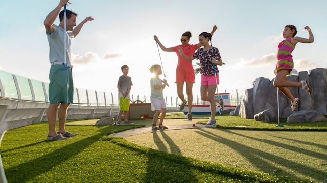 Family playing mini golf on Liberty of the Seas