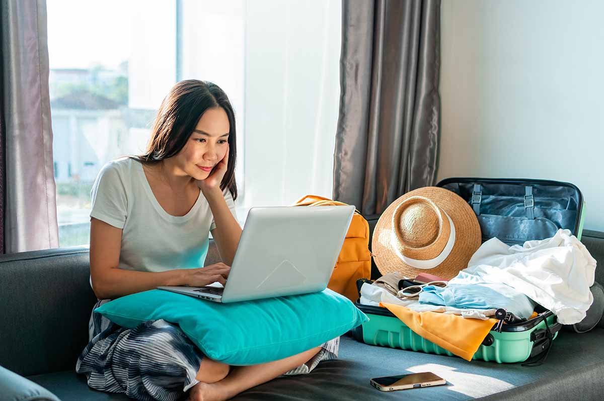 Woman effortlessly booking cruise holiday online